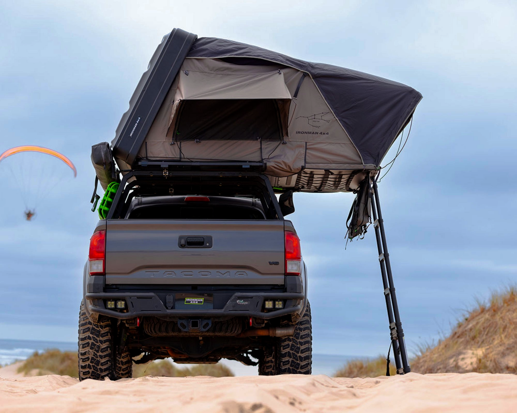 Rooftop tent pitched at camp